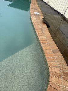 A pool with a bad leak needing repairs