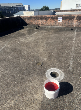 Stormwater inspection opening on pavement