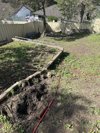 Sewer pipe excavation near house