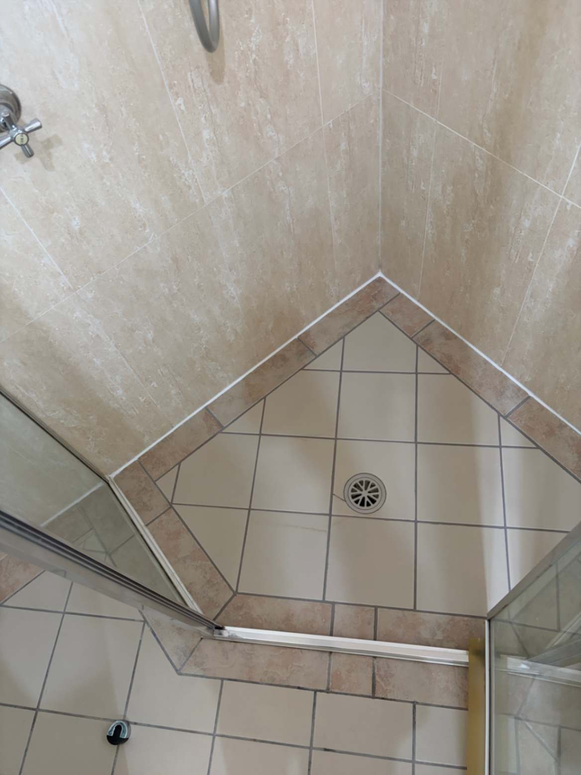 Shower base showing drain fully repaired and sealed