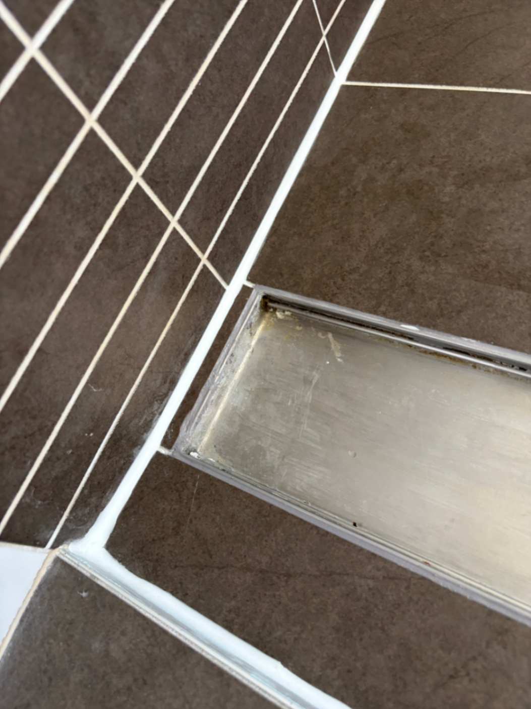 Damp bathroom floor around shower area prior to work